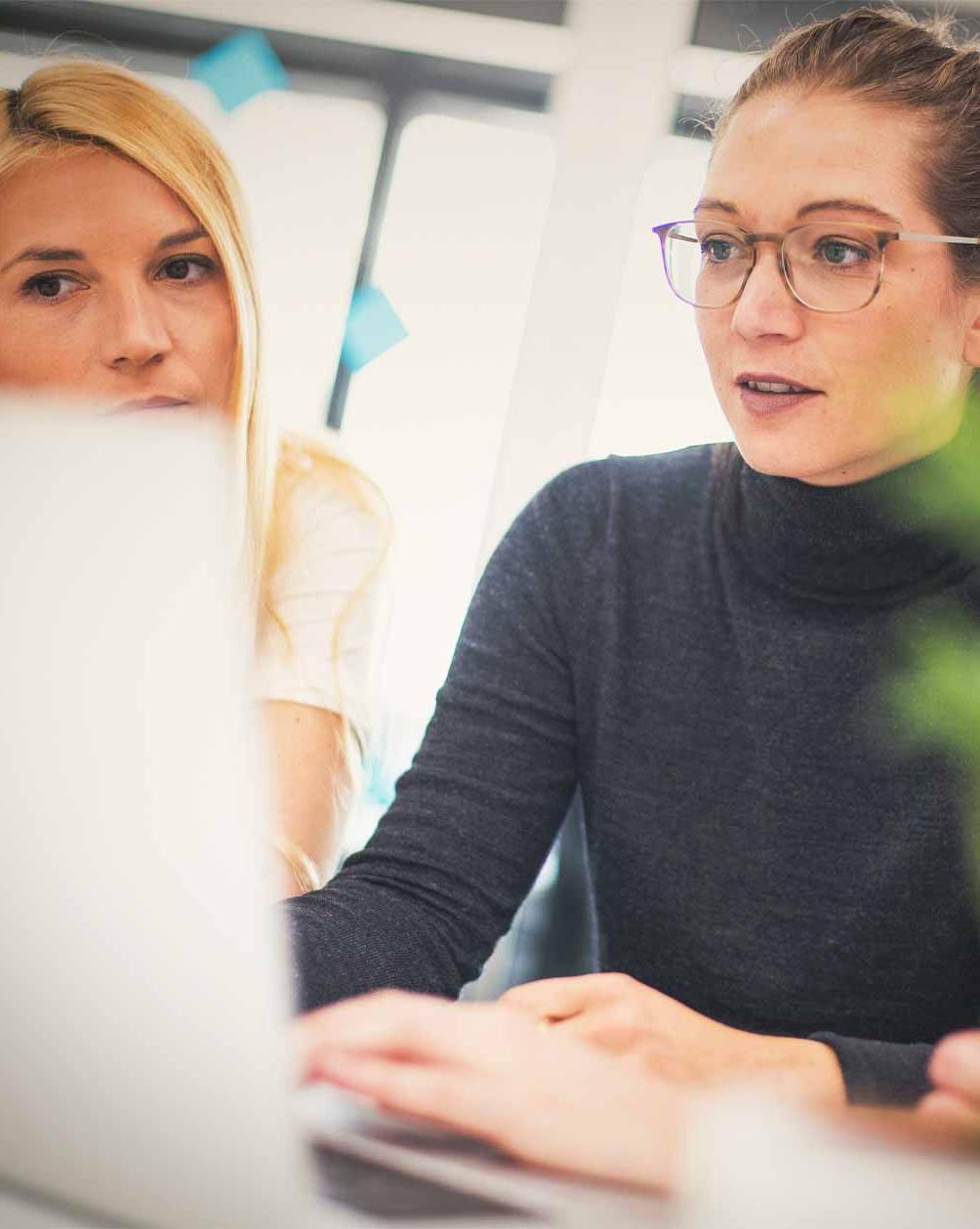 Women looking at a laptop working